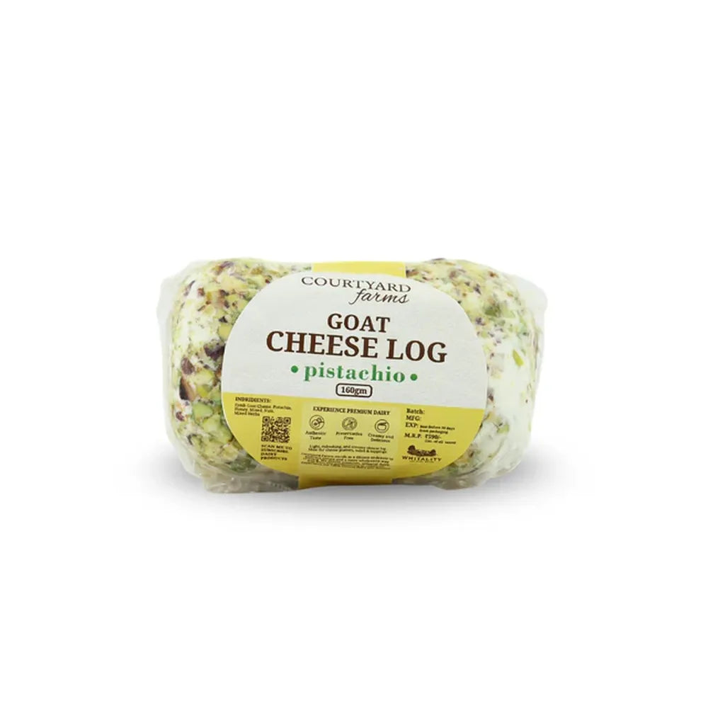 Goat cheese log with pistachio flavor in clear packaging on a white background