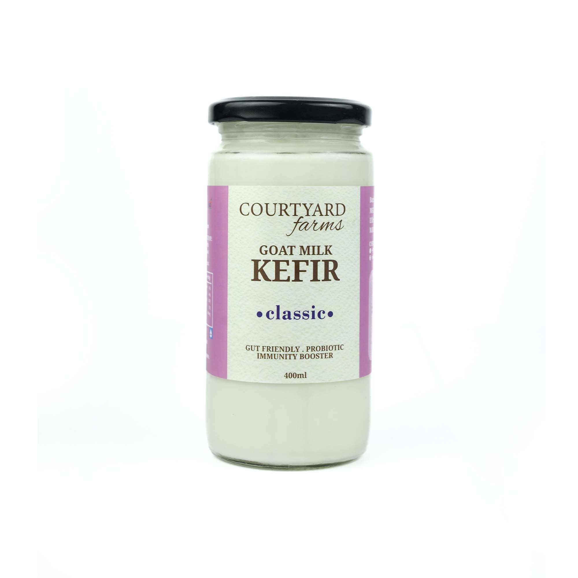 Jar of goat milk kefir on a white background