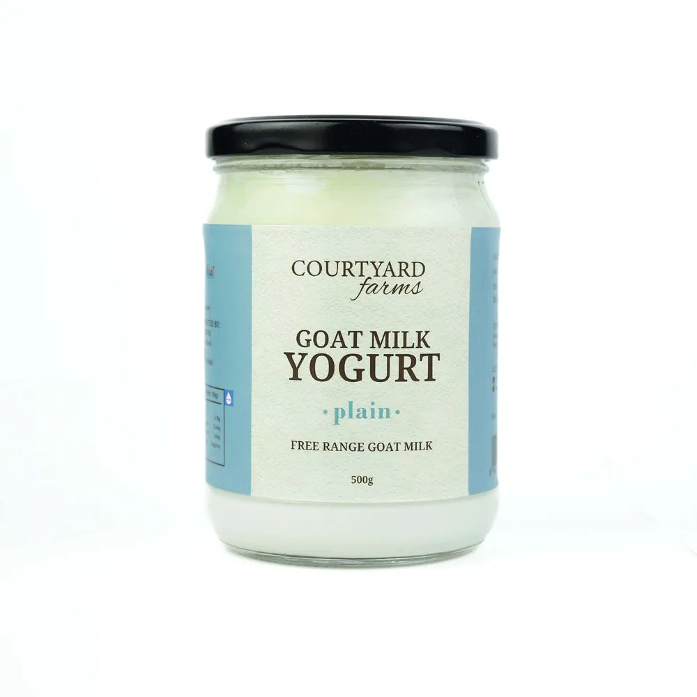 Jar of Courtyard Farms goat milk yogurt on a white background