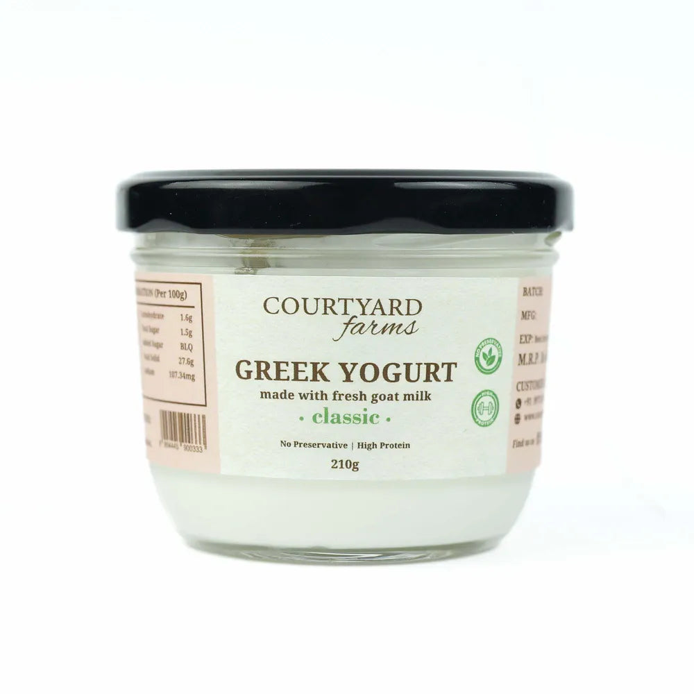 Jar of Courtyard Farms Greek Yogurt on a white background