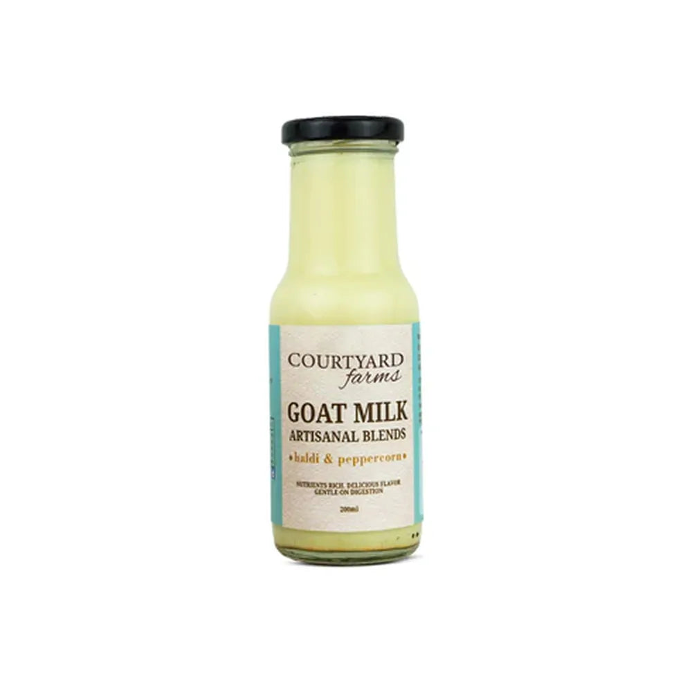 goat milk haldi pepper flavored milk artisanal blend golden milk drink in glass bottle Courtyard Farms